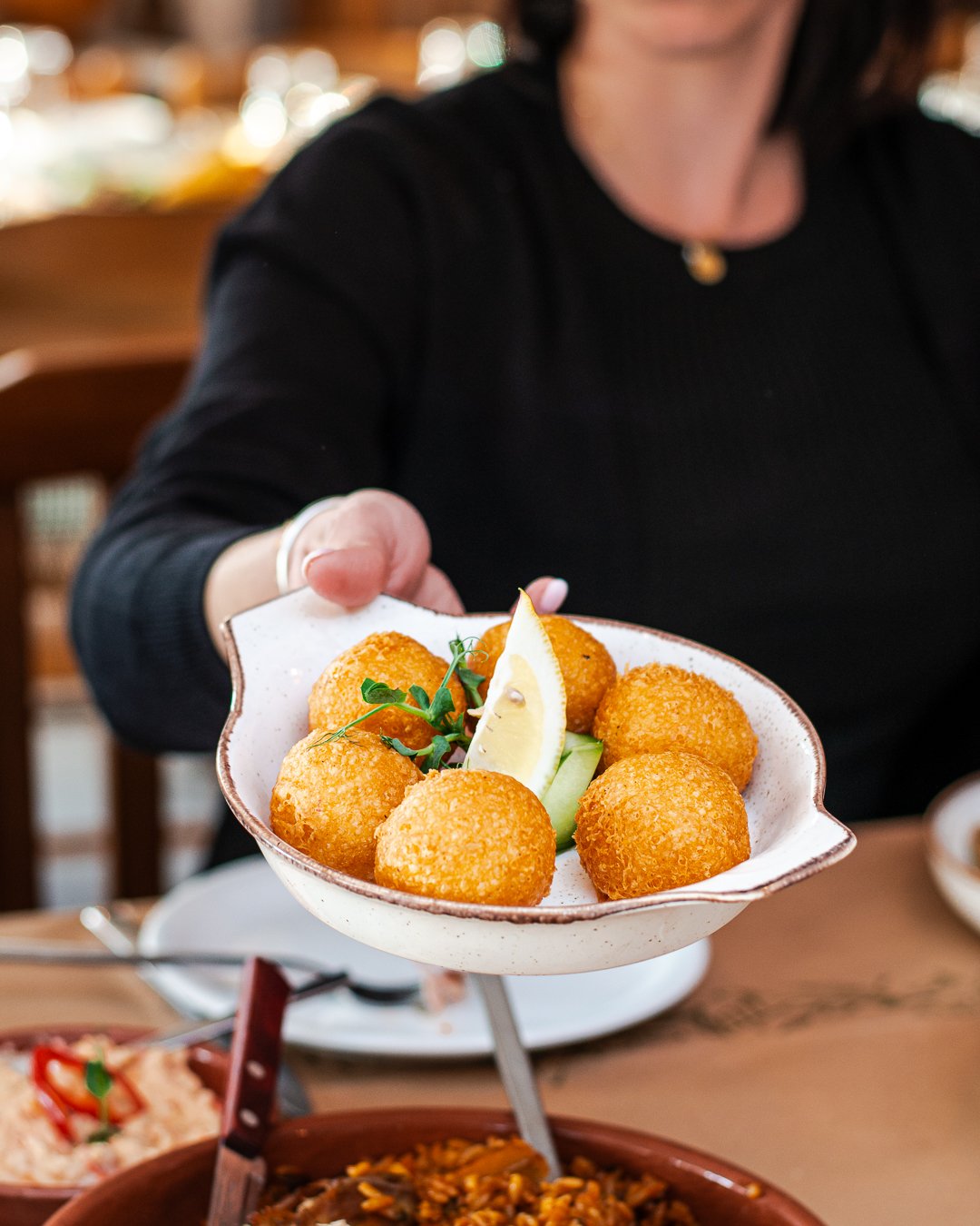 _FRG8316 Homemade fritters served with lemon