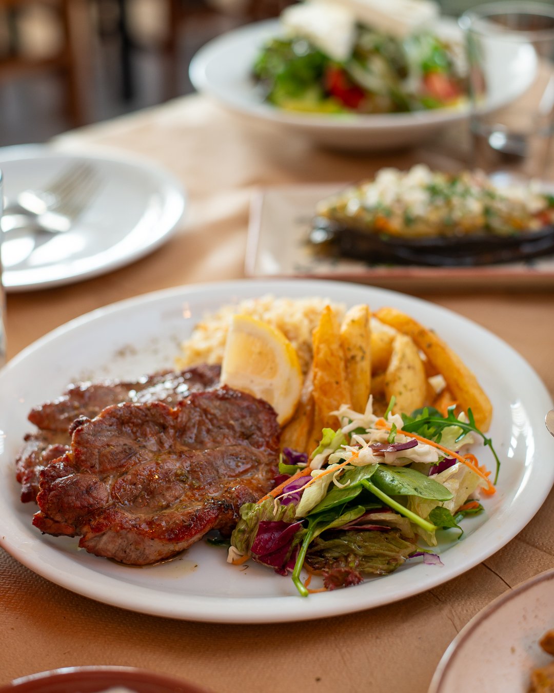 Grilled meat with potatoes and greens